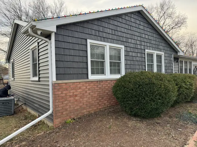 siding contractor, Portillo Roofing completed vinyl siding on a residential home exterior