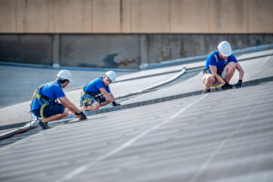 Team of three engineers installing solar panels, roofers near me, local roofers near me, roofers near me, roofing companies near me, roofing contractor near me, roof repair near me, roof replacement near me, residential roofers near me, commercial roofers near me, licensed roofers near me, insured roofing contractor near me, storm damage roof repair near me, emergency roof repair near me, roof inspection near me, roofing estimates near me, shingle roofers near me, flat roof contractor near me, roofing services Central Illinois, best roofers near me, roofing company Central Illinois, nearby roofing contractor, storm restoration roofing near me