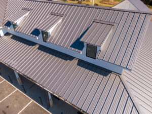 Aerial Drone View of Standing Seam Metal Roof on Modern Commercial Buildings, roofers Peoria IL, roofing company Peoria IL, roof repair Peoria IL, roof replacement Peoria IL, residential roofing Peoria IL, commercial roofing Peoria IL, roofing contractor Peoria IL, roof inspection Peoria IL, storm damage roofing Peoria IL, hail damage roof repair Peoria IL, local roofers Peoria IL, emergency roof repair Peoria IL, roofing services Peoria IL, shingle roofing Peoria IL, flat roof repair Peoria IL, roof leak repair Peoria IL, Peoria roofing contractors, roofing estimates Peoria IL, Midwest roofing contractor, storm restoration Peoria IL